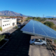 A solar carport providing shade to vehicles | Solar Gain